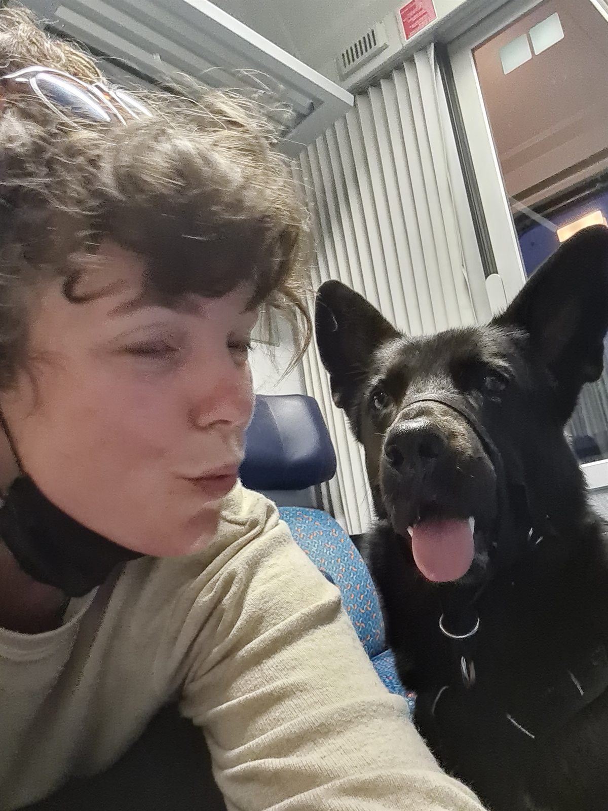 Yeldi and Mia sitting together on a train